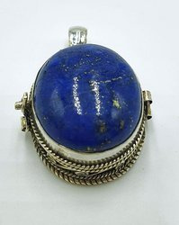 Silver ghau with lapis lazuli stone.