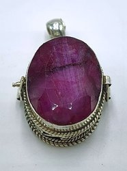 Silver ghau with ruby stone.