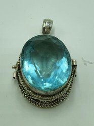 Silver ghau with aquamarine stone.