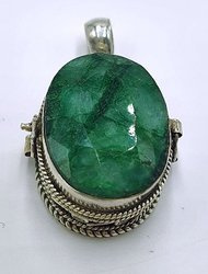 Silver ghau with emerald stone.