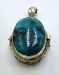 Silver ghau with turquoise stone.